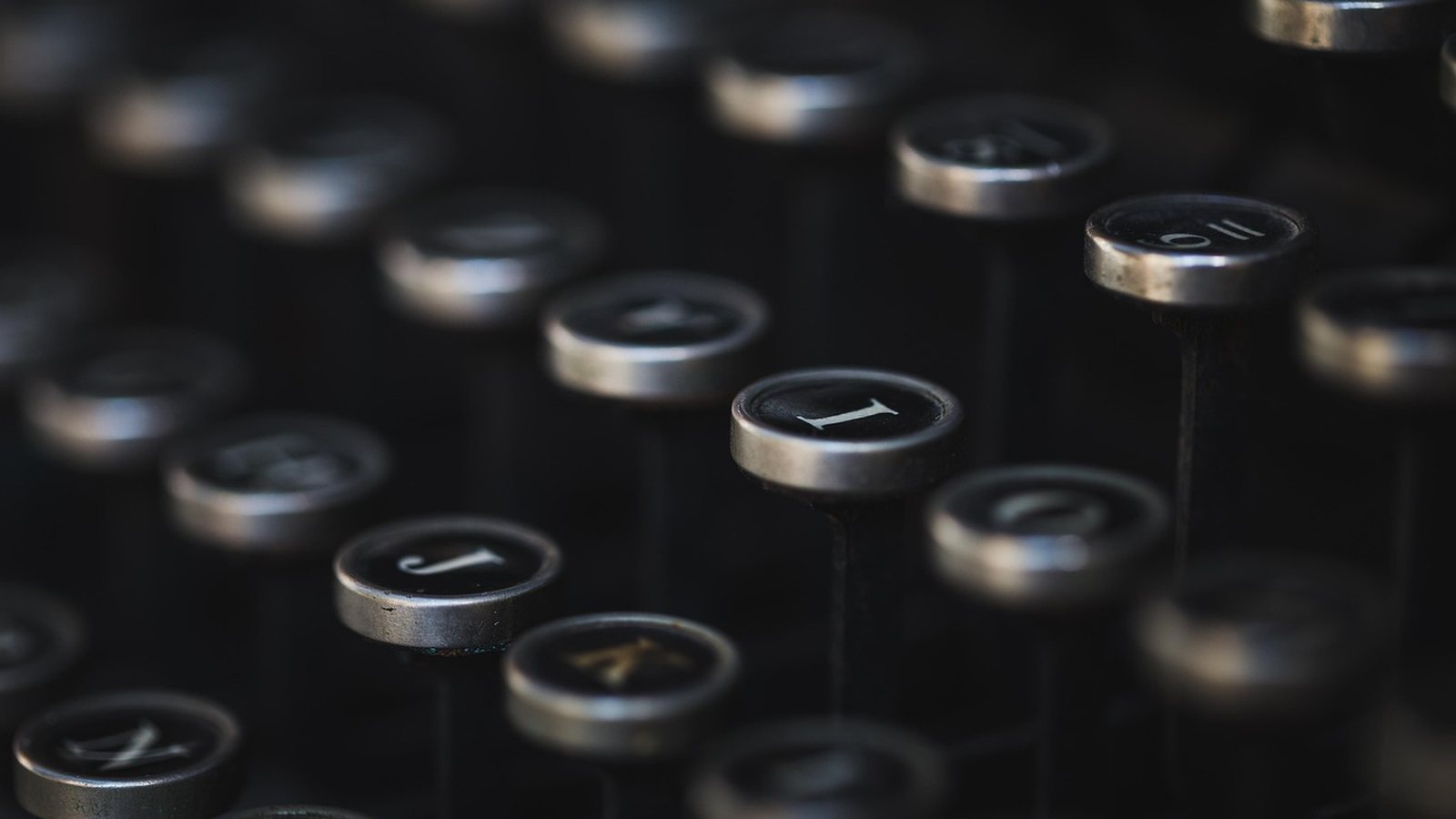 Close-up of vintage typewriter keys — the editorial spirit of the desk